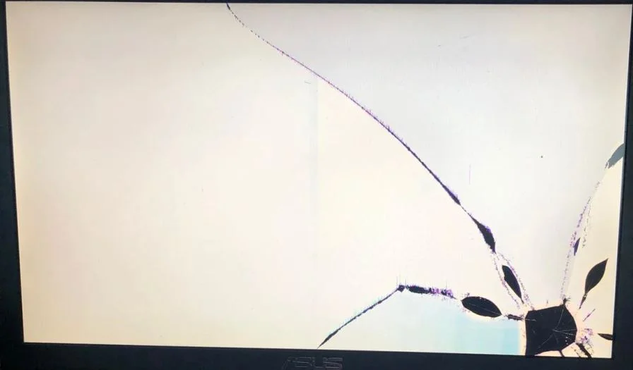 cracked laptop screen with distorted lines